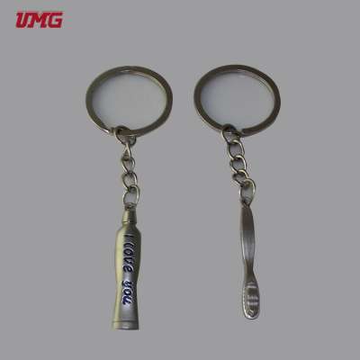 Yellow metal tooth key chain gifts for dentists